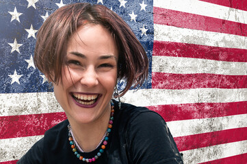 Happy young woman against the background of the US flag
