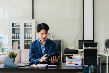 Fototapeta premium Business man working at office with laptop and documents on desk.