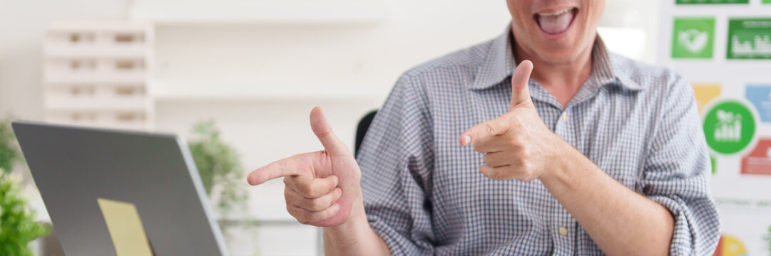 Adult Caucasian man giving thumbs up celebrating sustainable business achievements and environmental governance progress - Powered by Adobe
