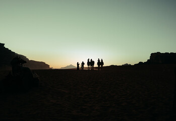 Camel Caravan Silhouettes at Sunset in Wadi Rum Desert, Jordan