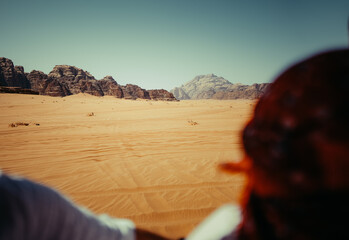 Tourists Exploring Wadi Rum Desert by 4x4 Vehicle