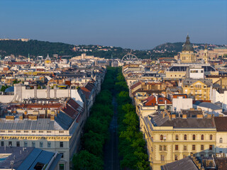 Andrassy street in Budapest, Hungary. Giant ferris wheel on the background