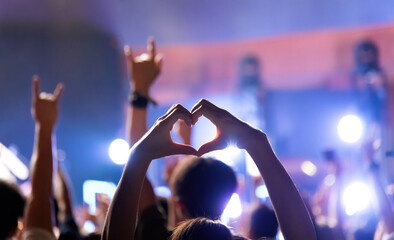 Heart shaped hands at the concert