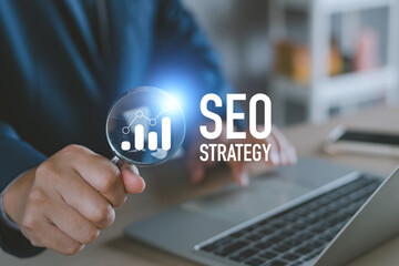 Business SEO strategy, Search Engine Optimization concept. businessman and magnifying glass with...