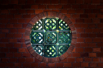 Chinese style window on brick wall