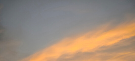 The sky and clouds are orange in the evening.