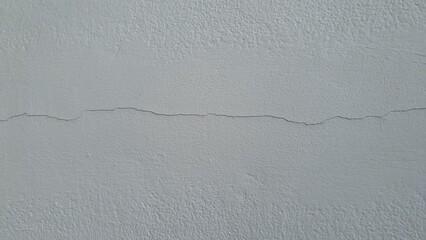 Small cracks on the white wall
