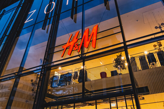 H&M Swedish fashion retailer company logo on a main store in the center of the city