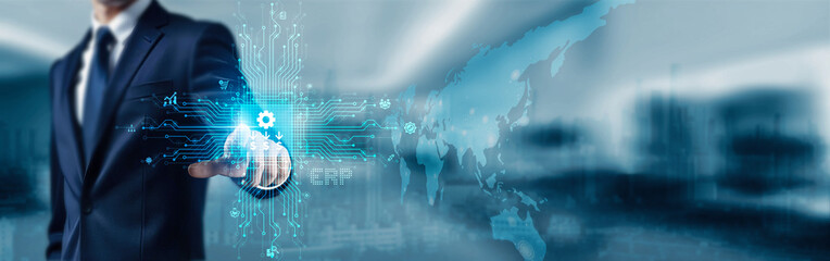Enterprise Resource Planning. Businessman touching icon and word ERP on digital touchscreen interface, symbolizing enterprise resource planning software streamlining business operations efficiently.
