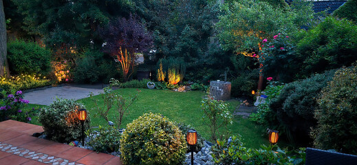 Beautiful home garden at sunset illuminated by lights  work with solar energy