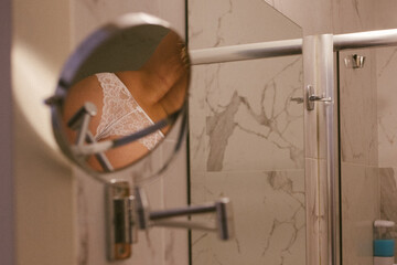 Woman in bathroom with wet slim sexy body taking a shower