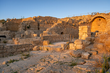 ruins of the ancient fortress of Caesarea. in the evening in the light of the setting sun