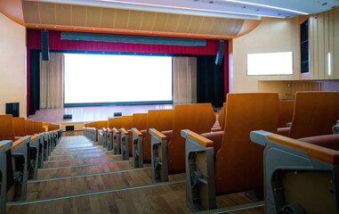Empty auditorium with many chairs