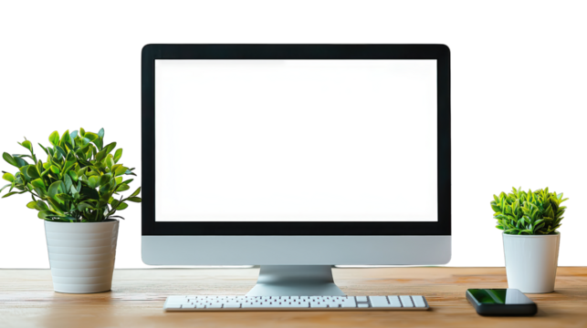 Computer with blank white screen on desk with small potted plants