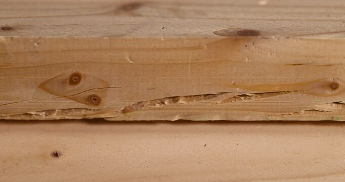 an old wooden board with cracks, a pine wood board cracked during operation, close up