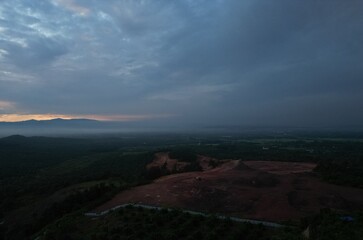 Golden Sunrise Above Mountains with Palm Oil Estate and Morning Fog Layers