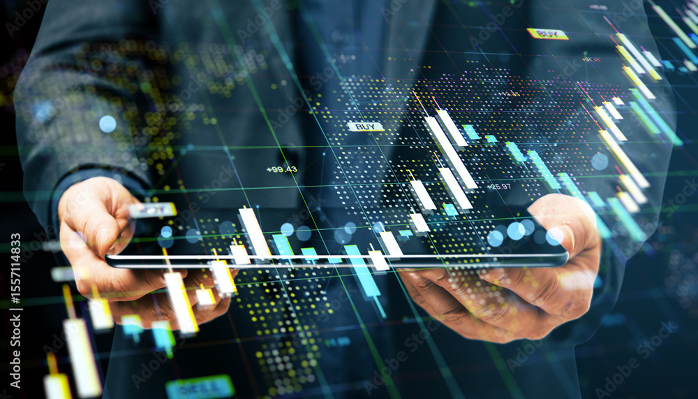 Poster businessman using tablet with financial data charts and forex market graphs overlayed on dark digita