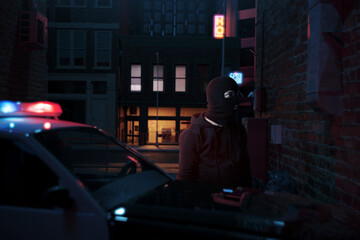 Digital composition of a masked man confronted by a polica car with flashing lights in a back alley