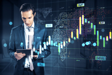 Businessman analyzing financial data on tablet with global stock market chart and glowing graphs in modern corporate digital environment.