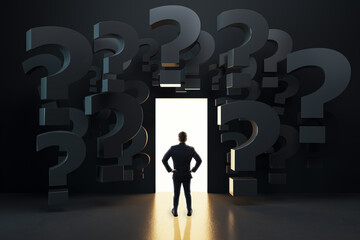Businessman standing in front of glowing doorway surrounded by large dark question marks, symbolizing career choices and unknown opportunities.