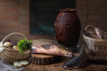Still life with fish and vegetables on a kitchen table
