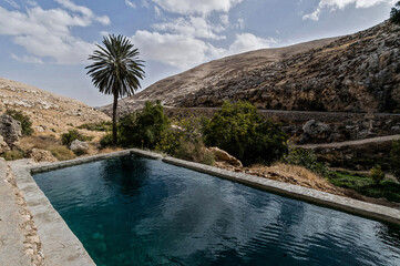 A naturally flowing, outdoor body of water used as a mikveh, a pool for Jewish ritual bathing.