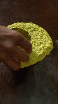Authentic Pesarattu getting spread onto a tawa for Freshly Andhra Breakfast