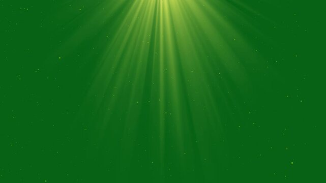 particles and light shining down. Light from the sun. green screen