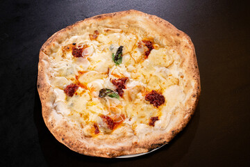 fresh white neapolitan pizza on black background
