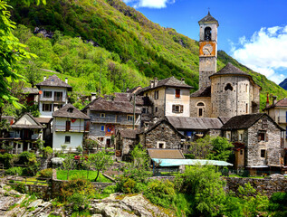 Fototapeta premium alpine landscape of Lavertezzo village with Roman Bridge and Madonna degli Angeli Parish Church, Switzerland