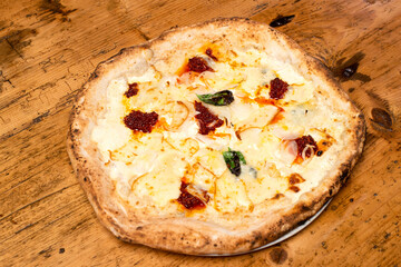 fresh white neapolitan pizza on wooden background