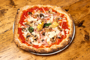hot italian fresh baked capricciosa pizza