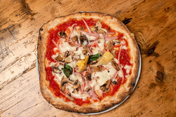hot italian fresh baked capricciosa pizza