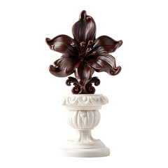 Chocolate sculpture of a flower on a white pedestal, isolated on a white background.