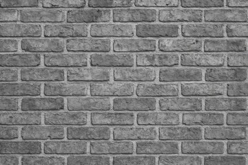 Vintage brick wall with a grayscale filter as a textured backdrop