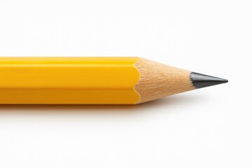 Large yellow wooden pencil with graphite tip on a white background