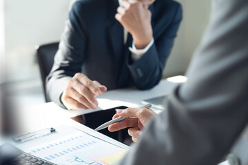 Business meeting in company.  Businessman in office using laptop computer and digital tablet....