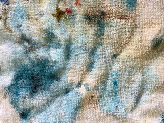 Dirty white towel. Colorful dirty towel after cleaning duty, selective focus
