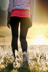 Walking and enjoying the sunset in the meadow, walking in nature is a care for maintaining health, the concept of a healthy lifestyle