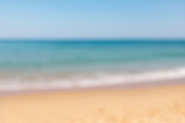 Fuzzy image of a coastal shoreline with sand and water