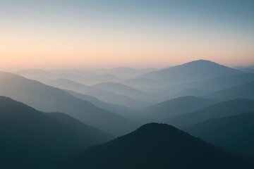 Fototapeta premium Early morning view of a misty mountain silhouette