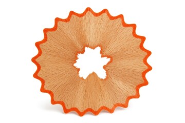 Close-up of a pencil shaving seen from the front on a plain white surface