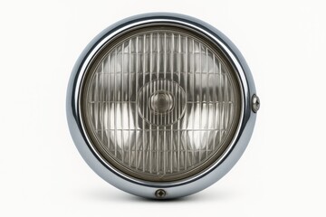 Close-up of a circular vintage chrome headlamp from a front perspective isolated on a white background