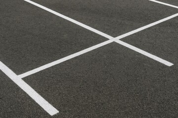 Fototapeta premium Close-up of parking lot markings and signage for vehicle spaces