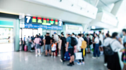 Blurred background people are queuing up to check tickets