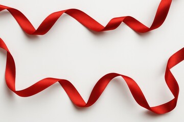 White background showcasing a red ribbon for gift wrapping