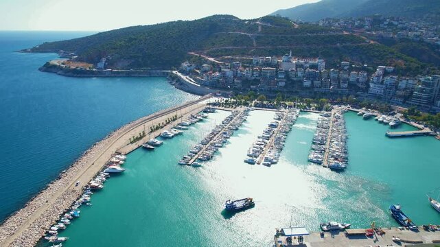 Aerial top view luxury White Yacht, boats parking in mediterranean sea pier, Travel cruise in Finike Turkey