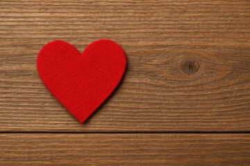 Fototapeta premium Crafted Felt Heart on Wooden Surface