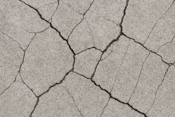 Obraz premium Damaged cement concrete roadway with visible cracks