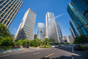 Captivating View of Tall Skyscrapers Amidst Urban Greenery on a Sunny Day